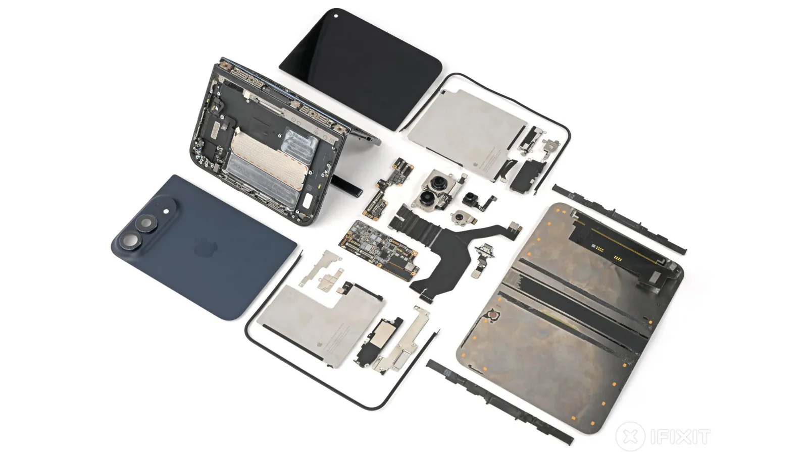 The iPhone Duo taken apart by iFixit, with its hinge, screens, batteries and cameras laid out