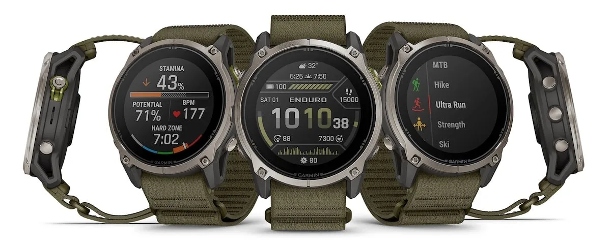 Three Garmin Enduro 4 watches in olive nylon bands showing stamina, the main face and an activity list